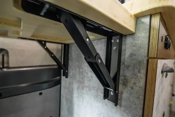 Flip-up-Table-arm-in-van-6-600x400.webp